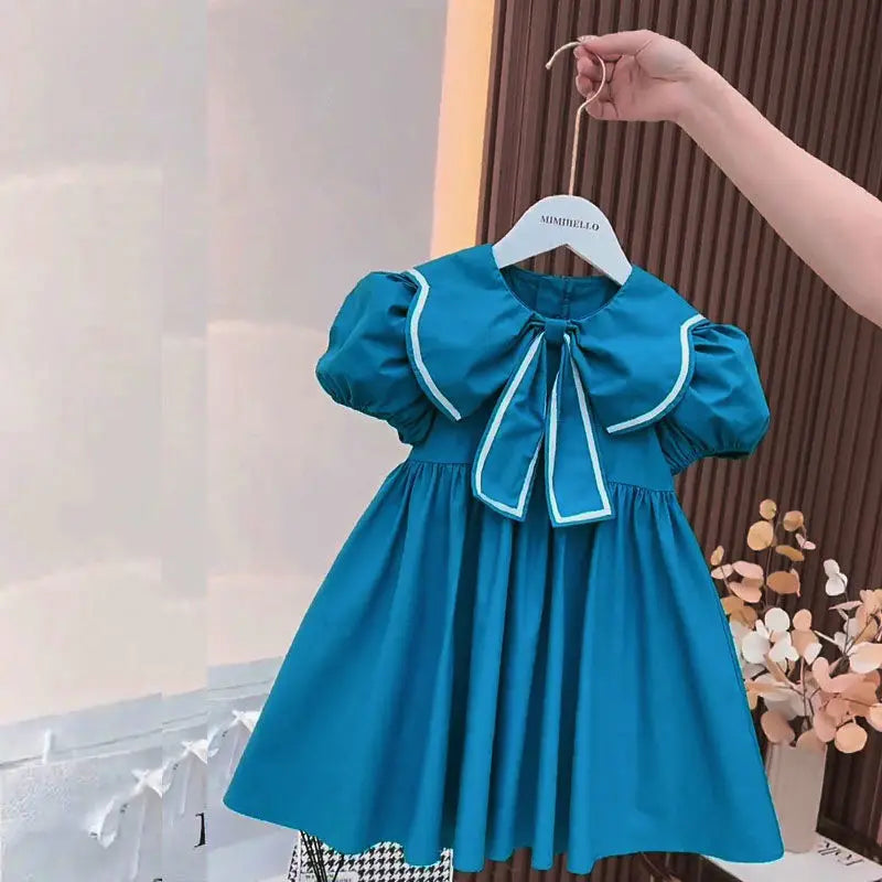 Vestido Infantil “Princesa Azul” – Mangas Bufantes e Laço Floral
