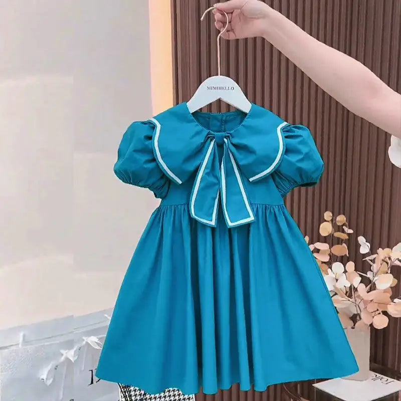 Vestido Infantil “Princesa Azul” – Mangas Bufantes e Laço Floral
