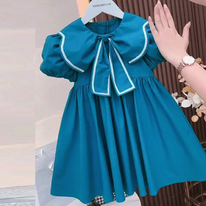 Vestido Infantil “Princesa Azul” – Mangas Bufantes e Laço Floral