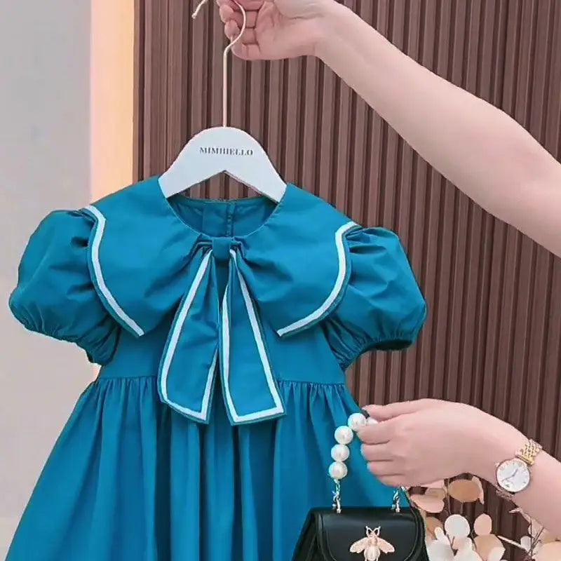 Vestido Infantil “Princesa Azul” – Mangas Bufantes e Laço Floral